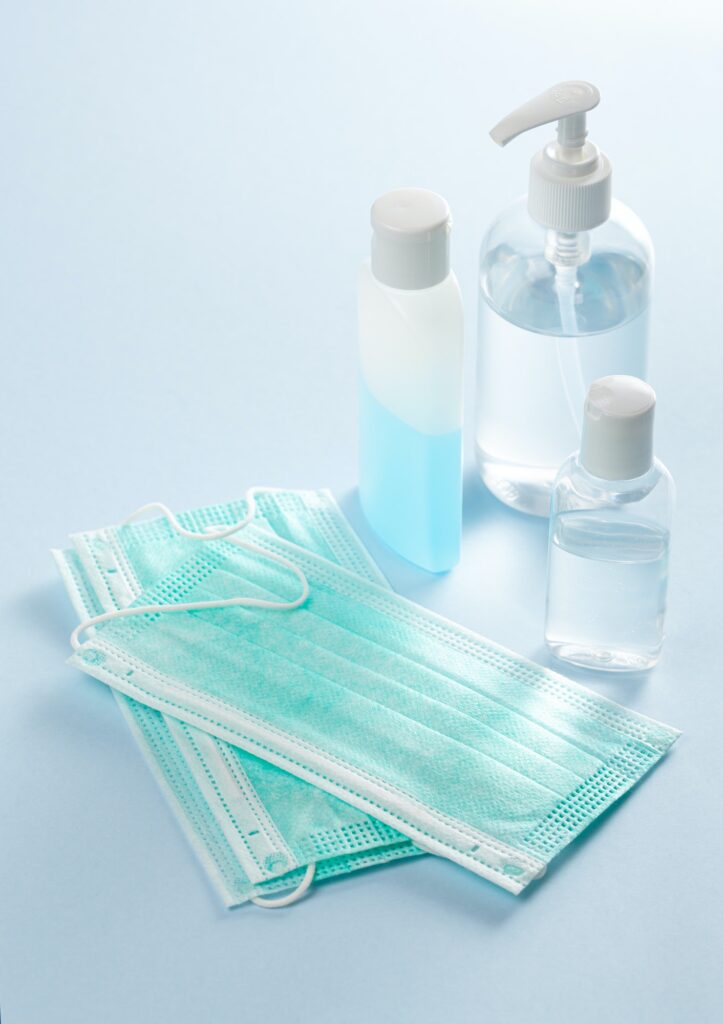 protective medical mask and sanitizer disinfecting gel. protective measures against virus, bacteria